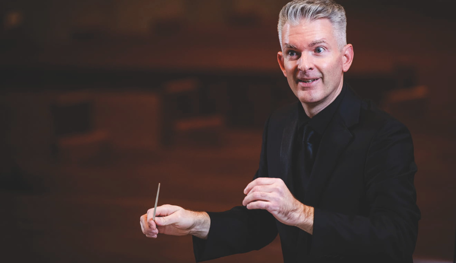 Artistic Director Michael Driscoll conducting  - WPI Journal image